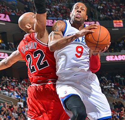 Andre Iguodala absorbs contact as he attacks the basket in the 76ers' comeback victory over the Bulls.  (Getty Images)