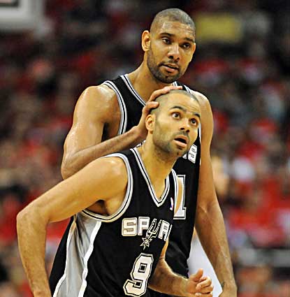 Tim Duncan, who scores 19 points, pats teammate Tony Parker (24 points) on the head as the Spurs rally to win Game 3. (US Presswire)