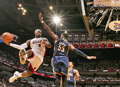 LeBron James (30-10-8) demonstrates why he is MVP. The Heat's superstar finishes two assists shy of a triple-double. (Getty Images)
