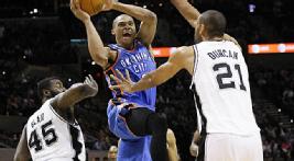Thunder PG Russell Westbrook drives the lane at the AT&T Center, only to face the Big Fundamental.