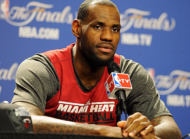 Appearing long-suffering, James makes quick work of reporters' questions on Saturday. (Getty Images)