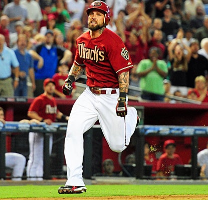 Ryan Roberts charges toward home to complete his two-run inside-the-park homer agianst the Mariners. (US Presswire)