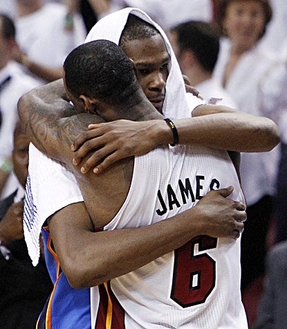 LeBron James gets his elusive title with a triple-double while Kevin Durant's first Finals trip ends in bitter disappointment.  (AP)