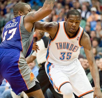 Kevin Durant scores 22 points and teams with Russell Westbrook to spur the Thunder past the Suns.  (US Presswire)