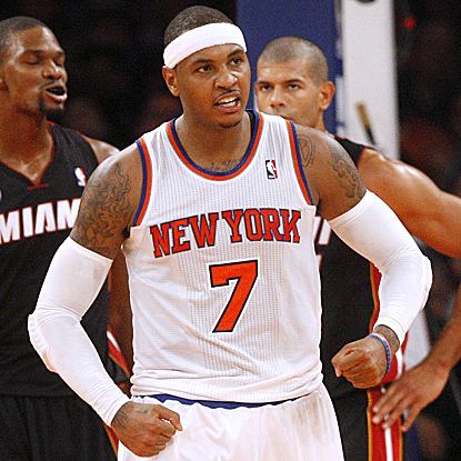 Carmelo Anthony scores a game-high 30 points and grabs 10 boards to lead the Knicks past the Heat in New York's season opener. (AP)