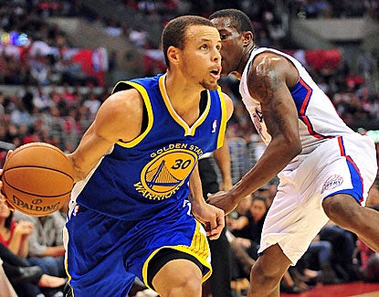 Stephen Curry not only scores 23 points for the Warriors, but he takes a key charge late. (US Presswire)