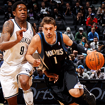 Alexey Shved leads the Wolves' comeback with two fourth-quarter 3-pointers and the go-ahead basket late in the game. (Getty Images)