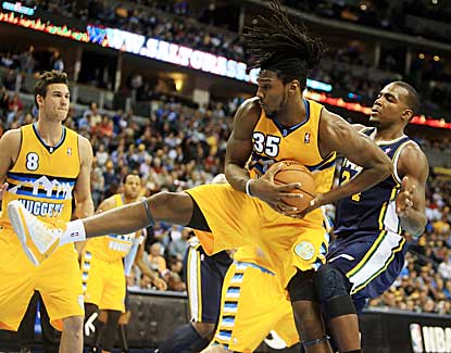 Denver forward Kenneth Faried snags a first-half rebound in the Nuggets' win over Utah on Friday. (US Presswire)