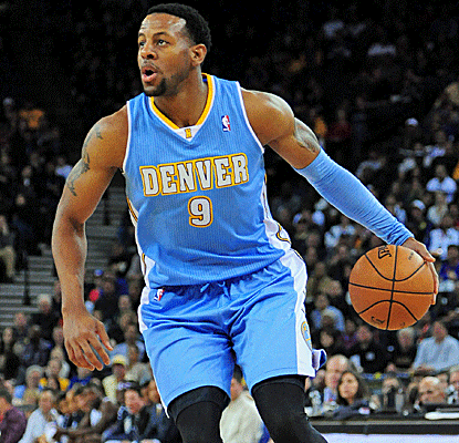 Andre Iguodala notches a double-double with 19 points and 12 boards, and also hits a huge three in overtime.  (US Presswire)