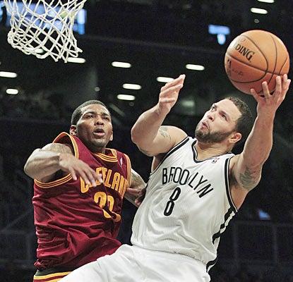 Deron Williams has a field day against the Cavs as he provides 26 points to go along with 10 assists. (AP)