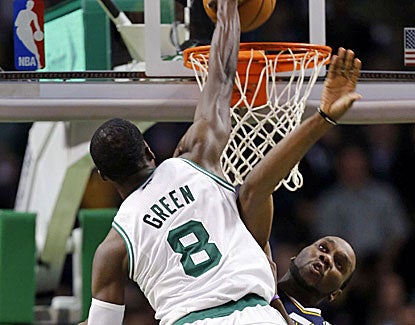 Boston forward Jeff Green jams in the face of the Jazz's Al Jefferson for 2 of his 16 points. (US Presswire)