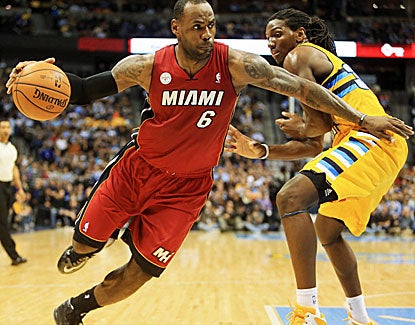 LeBron James dominates, even without his headband, against the Nuggets on Thursday, going for 27 points and 12 assists. (US Presswire)