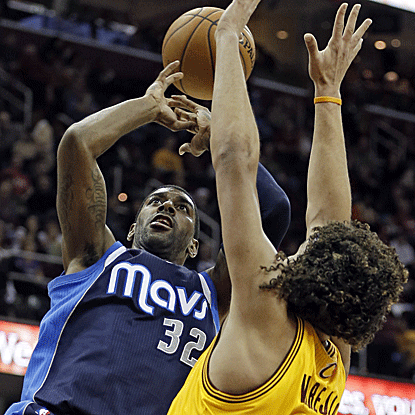 O.J. Mayo delivers a key 3-pointer and layup down the stretch to help the Mavericks get past the Cavaliers. (AP)