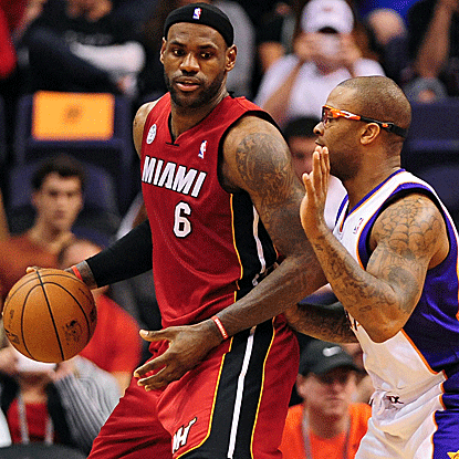 Battling flu-like symptoms, LeBron James scores 21 points in the Heat's road victory over the Suns. (US Presswire)