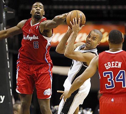 Tony Parker looks to pass after being stopped by DeAndre Jordan during the second half.  (US Presswire)