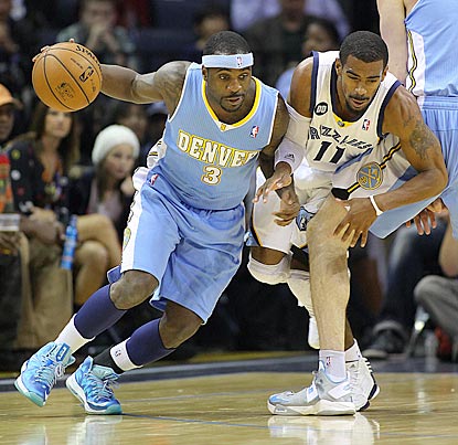 Denver point guard Ty Lawson, with help from a teammate's pick, evades Memphis' Mike Conley Jr.  (US Presswire)