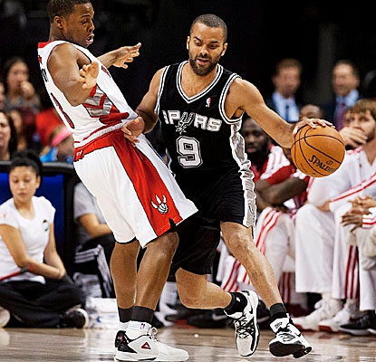 Tony Parker hits for six points of his 32 points in the second overtime as the Spurs hold off Toronto. (AP)