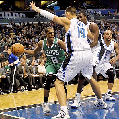 Time and again, Rajon Rondo finds a way around the Orlando defense, and nearly achieves a triple-double.  (US Presswire)