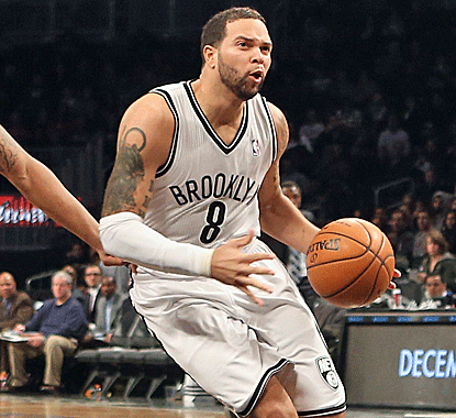 Nets point guard Deron Williams does a little bit of everything, including blocking a career-high four shots.  (Getty Images)