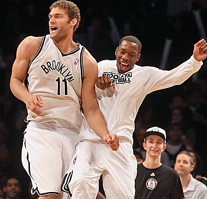 Brook Lopez celebrates after his double-double -- 22 points, 11 rebounds -- helps lifts the Nets in overtime.  (US Presswire)