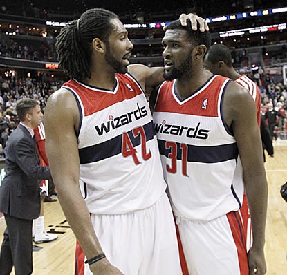Nene and Chris Singleton can finally celebrate. After a 0-12 start, the Wizards are finally in the win column.  (AP)