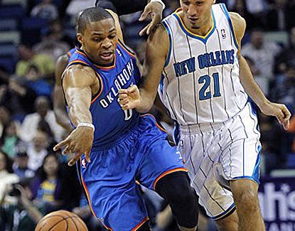 Russell Westbrook steals the ball from New Orleans guard Greivis Vasquez, one of three on the night for the OKC star. (AP)