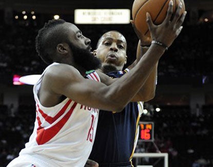 James Harden scores 18 points for the Rockets, who shoot 55 percent as a team in their win over Utah. (AP)