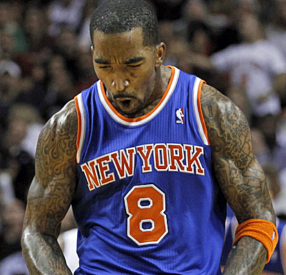 J.R. Smith is fired up after hitting a 3-pointer -- one of the 44 that the Knicks attempt in Miami.  (AP)