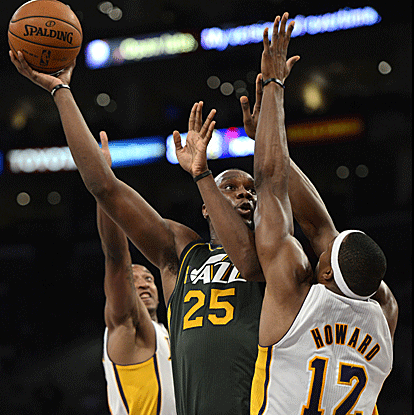 Al Jefferson (back spasms) returns to the Jazz to score 14 points and add 11 rebounds in a reserve role against the Lakers. (US Presswire)