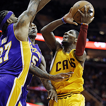 Kyrie Irving returns to the floor after missing 11 games to score 28 points in the Cavs' win vs. the Lakers. (AP)