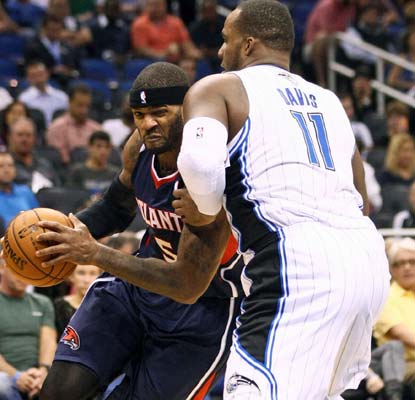 Josh Smith scores 16 for the balanced Hawks, who have won eight straight regular season games over the Magic.  (US Presswire)