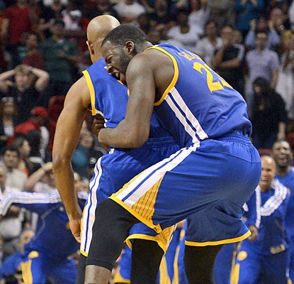 Draymond Green (right) celebrates with Jarrett Jack, who delivers the winning assist to Green to give the Warriors the lead. (AP)