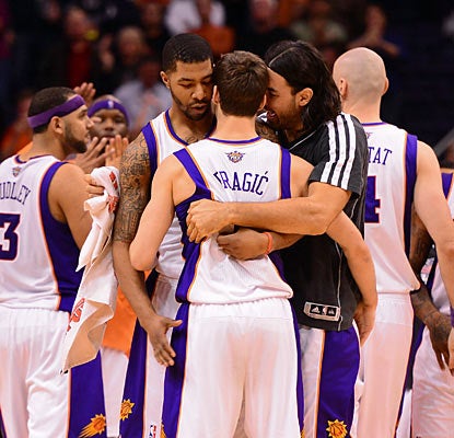 The Suns' Goran Dragic (center) gets love from his teammates after his game-winning shot. (US Presswire)