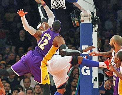 Carmelo Anthony takes a nasty spill, forcing him to leave the game. He scores 30 points before leaving in the 3rd quarter. (AP)