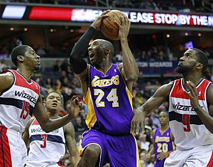 Kobe Bryant goes up for a shot against Jordan Crawford and Martell Webster. Bryant finished with 30 points. (US Presswire)