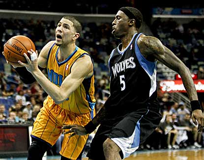 Hornets guard Austin Rivers drives past Minnesota forward Josh Howard on Friday night. (US Presswire)