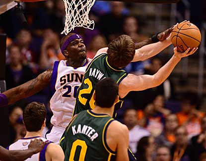 Phoenix center Jermaine O'Neal gets the block against Utah guard Gordon Heyward on Friday night. (US Presswire)