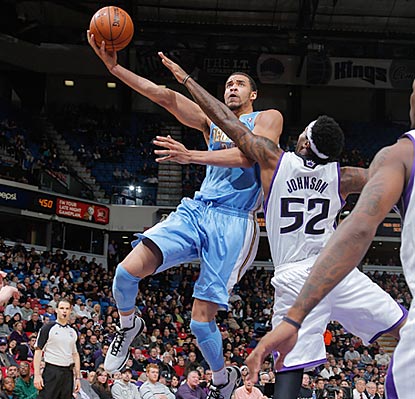 Denver's JaVale McGee, shown driving around James Johnson, scores a team-high 19 points off the bench on 7-of-9 shooting.  (Getty Images)