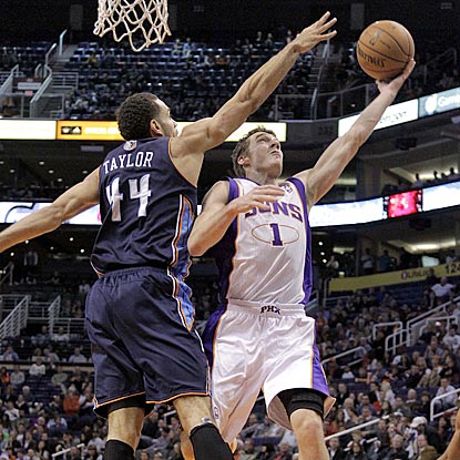 Goran Dragic, who scores 21 points on 8-of-13 shooting, drives around Charlotte's Jeff Taylor in the second half.  (AP)