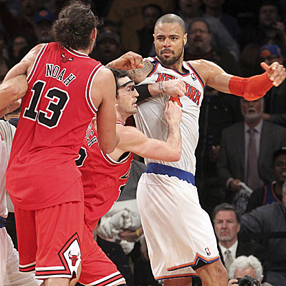The Bulls' Joakim Noah and the Knicks' Tyson Chandler are both ejected late in the fourth quarter.  (AP)
