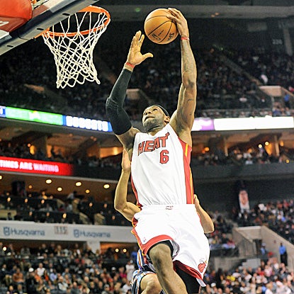 LeBron James scores two of his 27 points and adds 12 rebounds and eight assists in the win. (US Presswire)