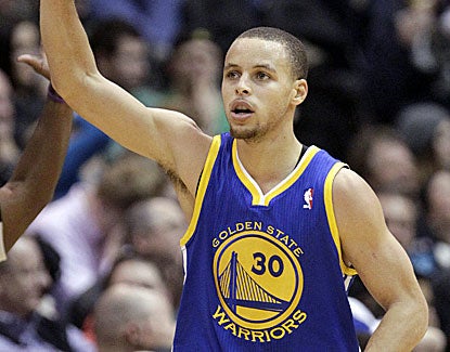 Stephen Curry's big night consists of 23 points, eight rebounds, seven assists, a steal and a blocked shot. (AP)