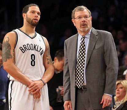 Deron Williams comes through with 19 points despite a wrist injury as P.J. Carlesimo comes away victorious in his debut. (Getty Images)