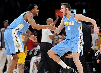 A jubilant Danilo Gallinari (right) celebrates with Andre Iguodala after hitting a dagger 3-pointer late in the fourth quarter. (US Presswire)