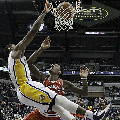 Paul George scores 29 points, including four 3-pointers, and adds 11 boards as the Pacers improve to 13-3 at home. (AP)