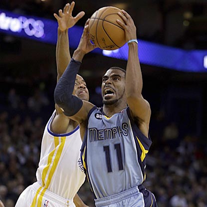 Memphis' Mike Conley (11), who winds up with 16 points, drives by Golden State's Jarrett Jack during the second half.  (AP)
