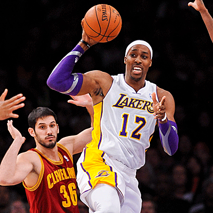 The Lakers' Dwight Howard scores 22 points and grabs 14 rebounds in his return from a three-game injury absence. (Getty Images)
