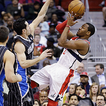 In his second game since returning from injury, John Wall tallies 12 points and six assists in 20 minutes for the Wizards. (Getty Images)