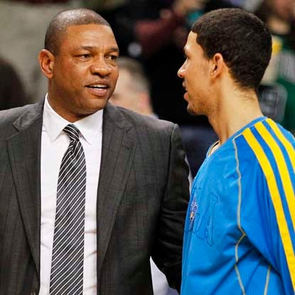 Austin Rivers gets the better of his father, Doc, in their first matchup in the NBA.  (Getty Images)