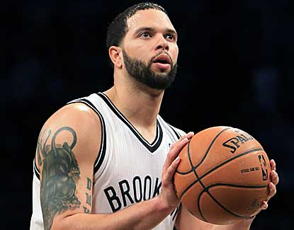 Deron Williams sinks four free throws down the stretch as the Nets hold off the Hawks. (US Presswire)